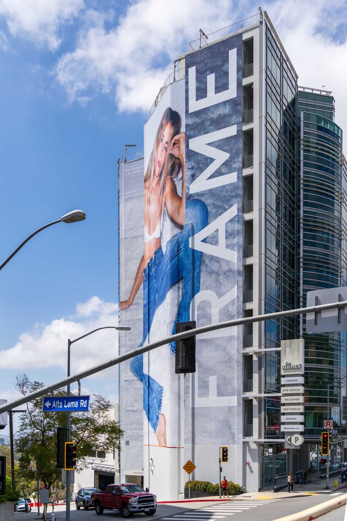 Oferty Large fashion advertisement on building wall at Alta Loma Road, West Hollywood.