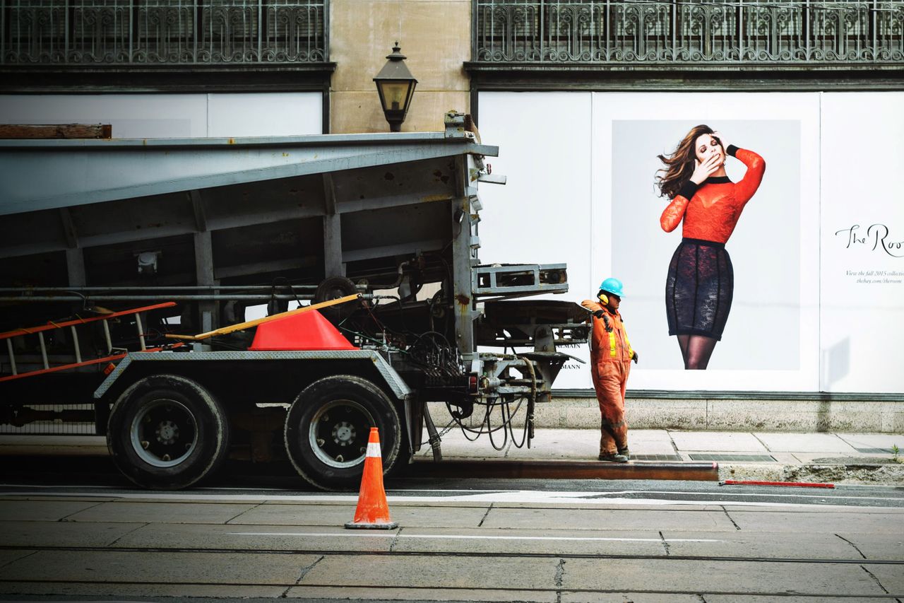 Mastering the First Impression: Your intriguing post title goes here A construction worker operates beside a truck on a city street.